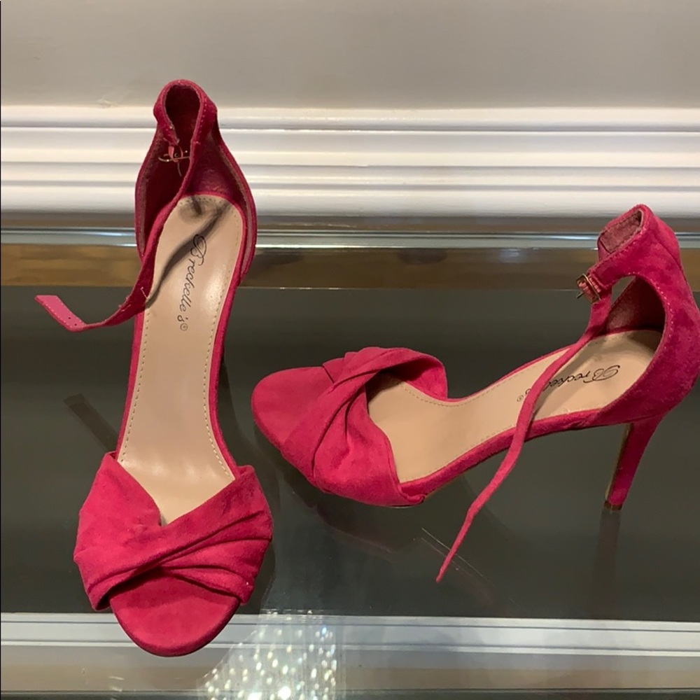 Hot pink stiletto sandals with ankle strap.